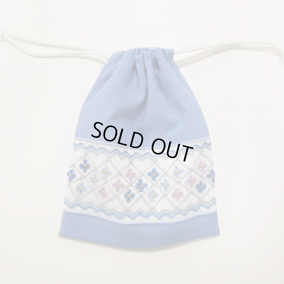 画像1: スモッキング刺繍の撥水ミニ巾着 (サックス） (1)